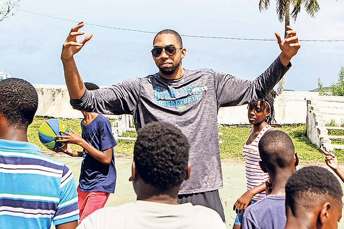 PROFESSIONAL basketball player and national team standout Jaraun “Kino” Burrows talks to young, aspiring players in Eleuthera about the game of basketball. 