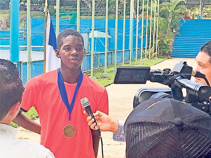 JACOBI BAIN, of the Bahamas, speaks to international media members after he won his first JITIC 16-and-under title on the COTECC Junior Circuit in El Salvador.