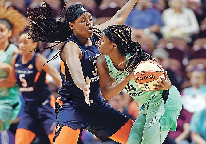 Connecticut Sun centre Jonquel Jones pressures New York Liberty guard Sugar Rodgers, right, during the first half on Wednesday night in Uncasville, Connecticut.

(Sean D Elliot/The Day via AP)

 