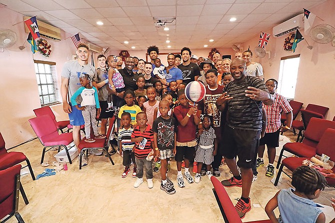 THE KENTUCKY Wildcats partnered with Samaritan’s Feet International to conduct a free shoe distribution
to children in the Fox Hill area at Faith Assembly of God.