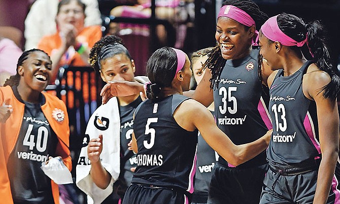 Connecticut Sun guard Jasmine Thomas (5) is greeted by teammates, from left to right, Shekinna Stricklen, Alyssa Thomas, Jonquel Jones and Chiney Ogwumike as she comes out of a WNBA basketball game against the Las Vegas Aces on Sunday. (AP)

 