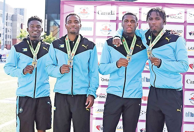 The Bahamas men's 4 x 400m relay team of Alonzo Russell, Michael Mathieu, Teray Smith and O'Jay Ferguson pose with their silver medals from the NACAC Championships. Photo: Anthony FosterTrack Alerts