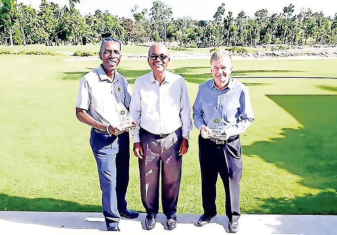 Sands Beer Cup Tournament Coordinator Marvin Bethell (centre) with Gross winner Anthony Hinsey (left) and Net winner Peter Muscroft (right).