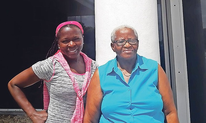 Loren Miller, left, president of the Cancer Society of Grand Bahama and Lucetta Johnson, a cancer survivor, right.
