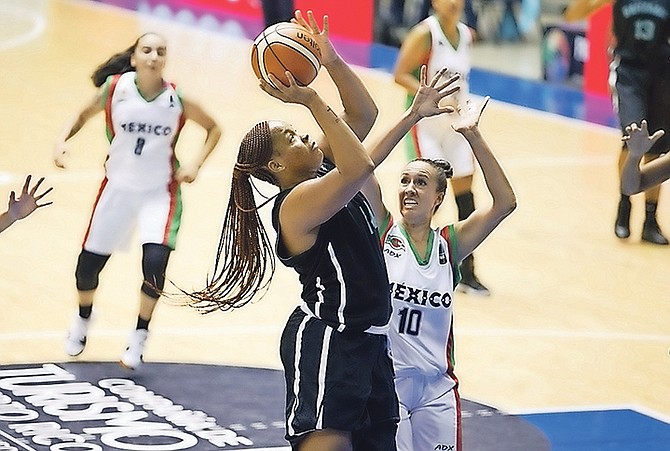 Leashia Grant goes up for a basket against Mexico's Safia Moreno.