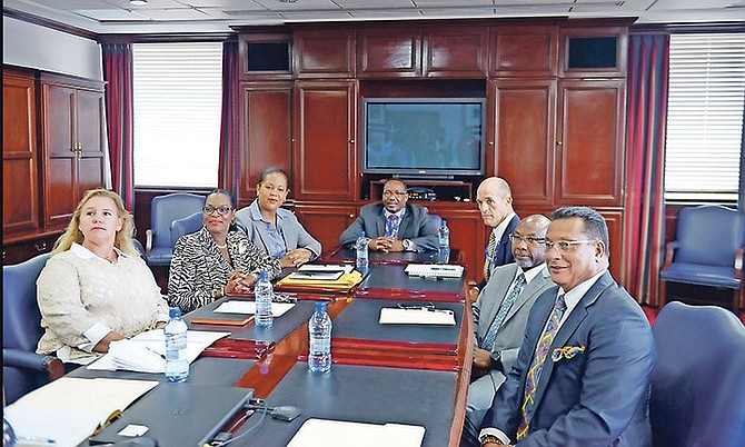 The new BPL board. From left, Robyn Lee Ogilivie, Debra Wood, Viana Gardiner, Donovan Moxey, chairman, Stephen Holowesko, vice chairman, James Moss, and Ferron Bethel.

Photo: Shawn Hanna/Tribune Staff