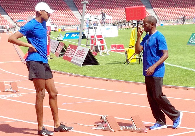 Coach Gary Evans gives some instructions to Steven Gardiner.