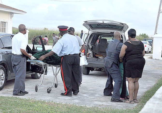 Police remove the body from the scene. Photo: Vandyke Hepburn