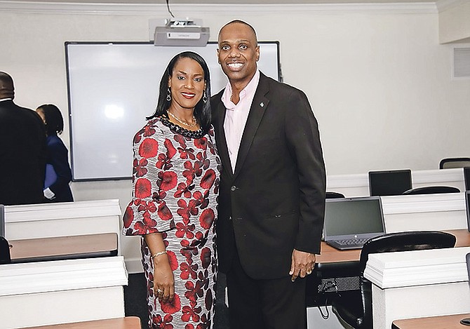 THE Rev Frederick McAlpine, MP for Pineridge, and his wife Tracey in one of the classrooms at his recently opened Pineridge Education Centre.