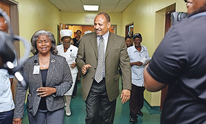 Minister of Health Dr Duane Sands with Mary Lightbourne-Walker in Princess Margaret Hospital. 
Photo: Terrel W Carey/Tribune Staff