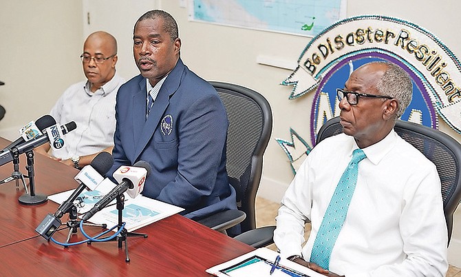 Captain Stephen Russell, centre, at the NEMA press conference yesterday with Basil Dean, right. Photo: Terrel W Carey/Tribune Staff

