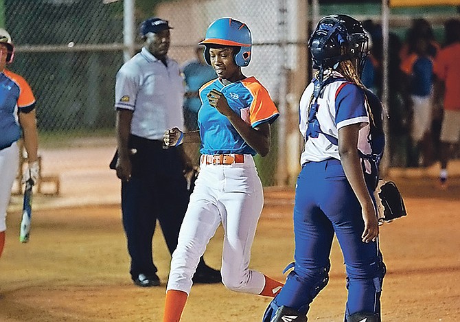 PLAY ACTION: The youthful Platinum Lady Sharks last night steamrolled past the Johnson’s Lady Truckers 11-4 in six innings to force a fifth and deciding game in their New Providence Softball Association semi-final series. 
Photo: Terrel W Carey/Tribune Staff 