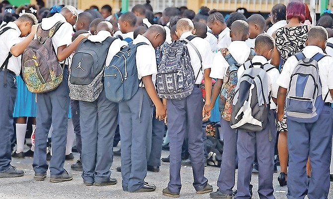 Students, faculity and staff of HO Nash held a special assembly yesterday after the armed robbery on Wednesday that led to the fatal shooting of Insp Carlis Blatch outside the school. The school also offered a special prayer for his family. Photo: Terrel W Carey/Tribune Staff
