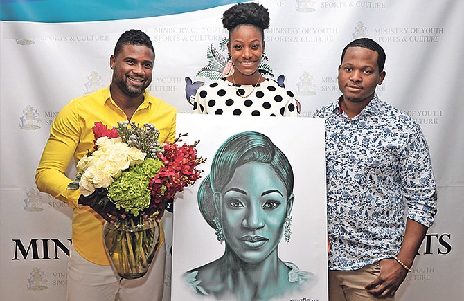 Musical artist Julian Believe (left) presents a bouquet of flowers as Jamaal Rolle presents a portrait to Golden Girl Shaunae Miller-Uibo. Photo: Eric Rose