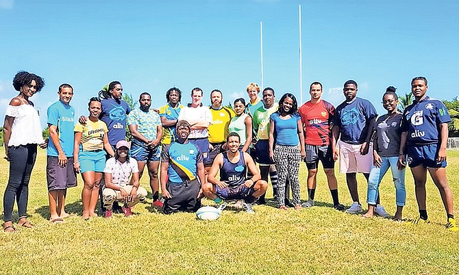 Executive members of ALIV pose for a photo with members of the Bahamas Rugby Association.