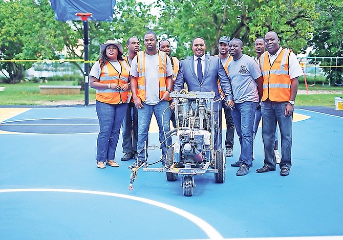 Shanendon Cartwright, St. Barnabas MP and Executive Chairman of the Bahamas Public Parks and Public Beaches Authority, pictured on the renewed Malcolm Park basketball court along with staff from the Bahamas Striping Group of Companies.

Photos: Terrel W Carey Sr/Tribune staff

 