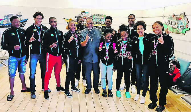 TEAM Bahamas members on their arrival at the airport this weekend after their “best team” performance in the annual Ocean State Judo Championships in Providence, Rhode Island.