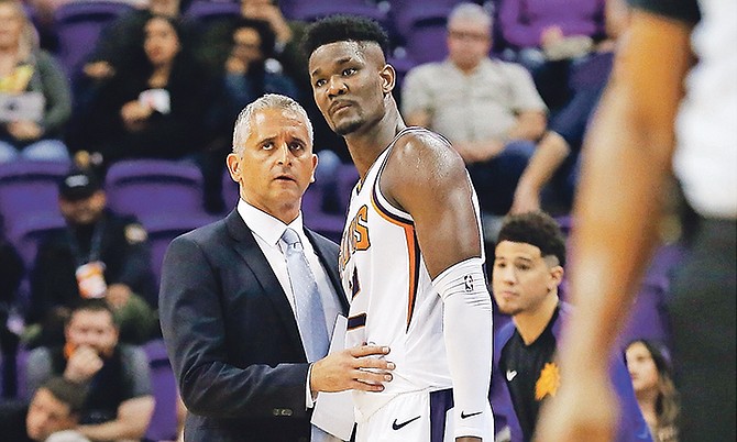 Phoenix Suns head coach Igor Kokoskov, left, talks with centre Deandre Ayton, right, during the second half of Monday’s preseason game against the Sacramento Kings. On Wednesday night, Ayton led the Suns to their first preseason win, defeating the New Zealand Breakers at the Talking Stick Resort Arena in Phoenix, Arizona.

(AP Photo/Ross D Franklin)

 