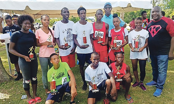 SOME of the winners of the Silver Lightning Track Club’s second annual William ‘Kunkclehead’ Johnson Cross Country Championship with sponsor Craig Flowers (back row) and organiser Rupert Gardiner (far right).