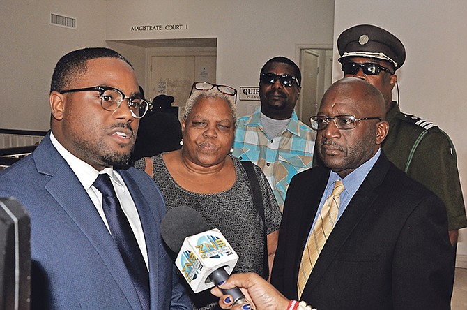 Attorney Renaldo Toote, left, speaks to the media after an inquest found his client, Ruis Gibson, right, lawfully shot a man that fatally stabbed his son. Photo: Vandyke Hepburn