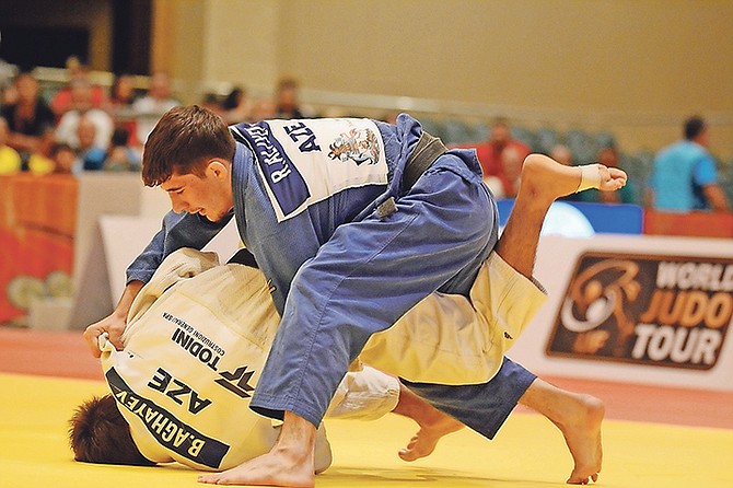 OUCH! - Judo athletes compete yesterday on day 1 of the International Judo Federation World Junior Championships in the Imperial Ballroom of the Atlantis resort on Paradise Island. Photo: Shawn Hanna/Tribune Staff

