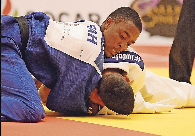 DESMOND BOOTLE, of the Bahamas, competes on day 2 of the International Judo Federation World Junior Championships in the Imperial Ballroom of the Atlantis resort on Paradise Island yesterday.

Photo: Shawn Hanna/Tribune Staff

 

 