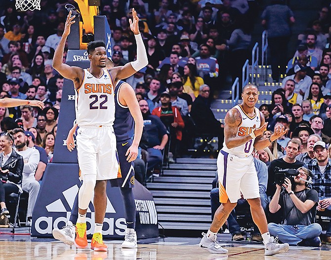 Phoenix Suns centre Deandre Ayton (22) and Isaiah Canaan (0) react to a call during the second quarter of Saturday’s game against the Denver Nuggets in Denver.

(AP Photos/Jack Dempsey)

 