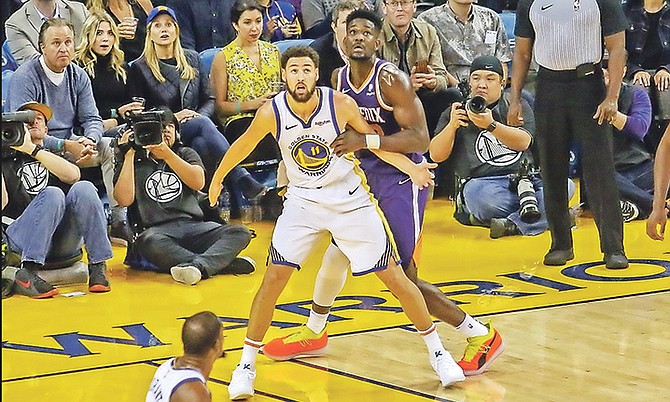 Golden State Warriors All-Star guard Klay Thompson and No.1 NBA Draft pick Deandre Ayton face off as the  Warriors won 123-103 over Ayton’s Phoenix Suns at Oracle Arena on Tuesday night.
Photo: 10thYearSeniors.com