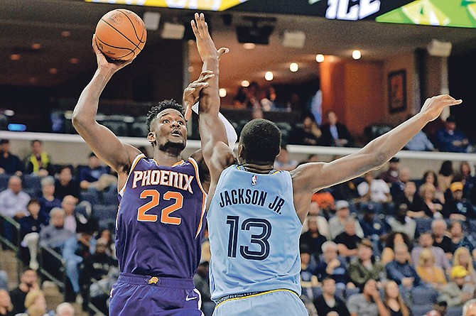 Phoenix Suns centre Deandre Ayton (22) shoots against Memphis Grizzlies forward Jaren Jackson Jr. (13) on Saturday.

(AP Photo/Brandon Dill)

 