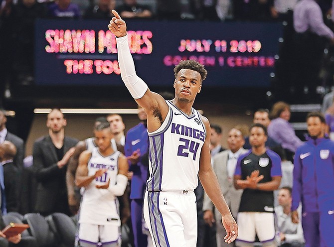 Kings guard Buddy Hield celebrates in the closing moments of the Kings’ 116-112 win over the Washington Wizards on Friday.

(AP Photo/Rich Pedroncelli)

 