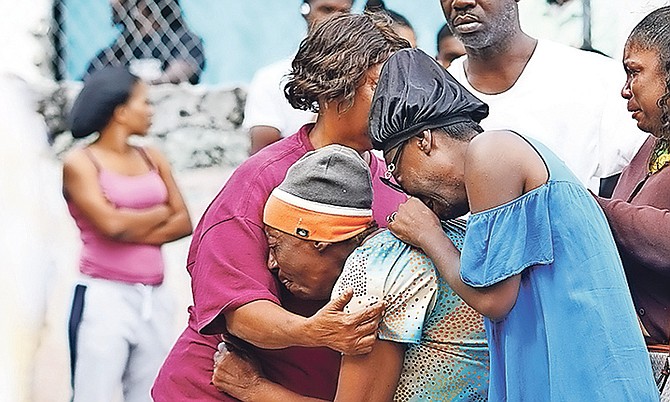 Emotions run high after a body was found at Okra Hill. Photo: Terrel W. Carey Sr/Tribune Staff