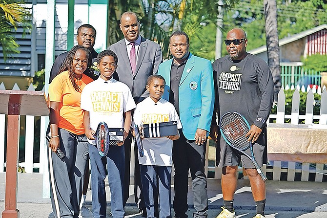 MAKING AN IMPACT: Shown (left to right in front row) are Sherline Moss, Mario Wright and Gavin Rolle. Shown (l-r in the back row) are Ricardo Demeritte Jr, Evon Wisdom, Derron Donaldson and Owen Forbes. Photo: Terrel W Carey Sr/Tribune Staff