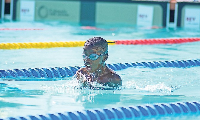 A SWIMMER competes in the Blue Waves Spring Invitational.

Photo: Shawn Hanna/Tribune Staff