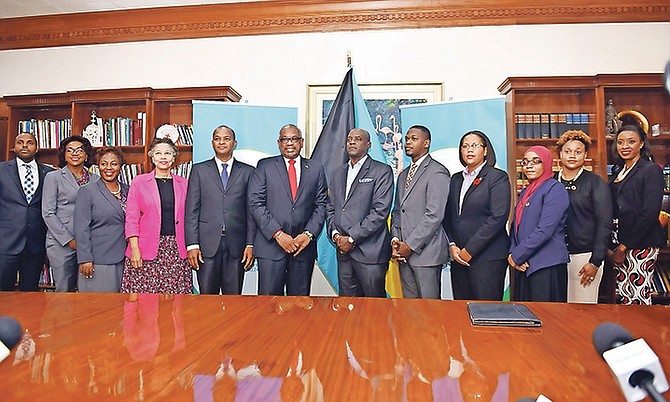 Prime Minister Dr Hubert Minnis accepted a 300,000 cheque from Dr Tyrone McKenzie, senior vice president of Albany Bahamas to assist with the Over-The-Hill programme. Pictured from left, Rocky Nesbitt, project officer; Myra Farquharson; Samita Ferguson, executive manager of Over the Hill Community Development Partnership Initiative (OTHCDPI); Nicole Campbell, permanent secretary of Office of the Prime Minister; Reece Chipman, MP for Centreville; Dr Minnis; Dr McKenzie; Travis Robinson, MP for Bain and Grants Town; Viana Gardiner, chief operating officer of Prime Minister’s Delivery Unit; Aneesah Abdullah, OTHCDPI member; Daniella Pratt, OTHCDPI member and Shanell Moss, OTHCDPI member. Photo: Shawn Hanna/Tribune Staff