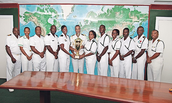 JOB WELL DONE: Shown (l-r) are Senior Lieutenant Elvis Bullard, RBDF Public Service Liaison Office, Lieutenant Elizabeth Simms, Training Executive Officer, Able Seaman Ryan Ferguson, Able Woman Marine Aniska Bonaby, Commodore Tellis Bethel, Leading Woman Marine Denise Oliver, Leading Seaman Devon Sands, Woman Marine Erica Longley, Force Chief Petty Officer Oral Wood, Command Force Chief, and RBDF Training Officer (Acting), Senior Lieutenant Origin Deleveaux. 
(RBDF Photo by Marine Seaman Michael Turner)