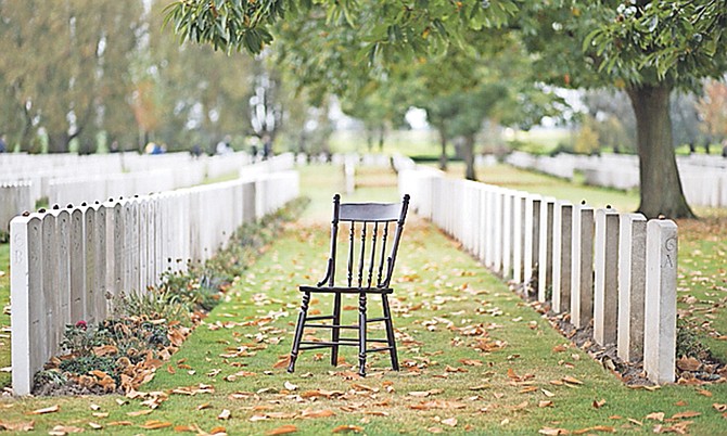 An artist put an empty chair in one of the hundreds of Flanders Fields war grave cemeteries.