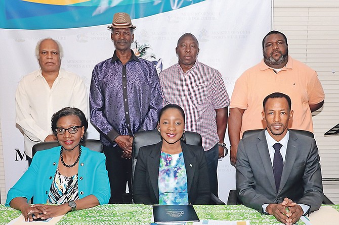SEATED (from left to right) are Acting PS Rhonda Jackson, Minister of Sports Lanisha Rolle and Director of Sports Timothy Munnings. Standing (l-r) are Hall of Famers Sammy Symonette, Peter Gilcud, Crestwell Pratt and Arthur Jr, representing his father.
Photo: Eric Rose/BIS