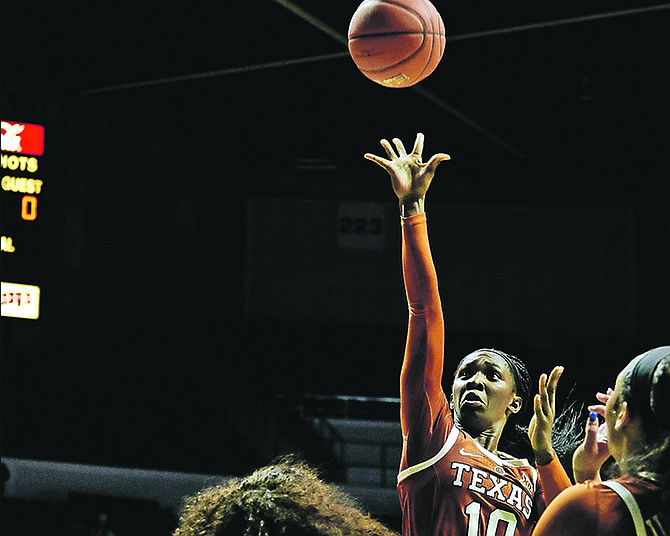 Texas’ Lashann Higgs (10) shoots the ball against North Texas in the second half of Monday night’s NCAA game. (AP)