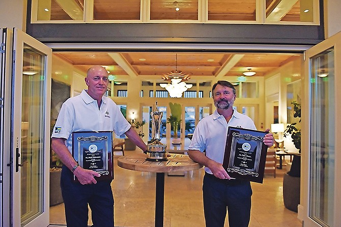A cocktail reception was held yesterday at The Island House to honour Mark Holowesko and Peter Vlasov on winning the World Sailing Championships. Photo: Shawn Hanna/Tribune staff
