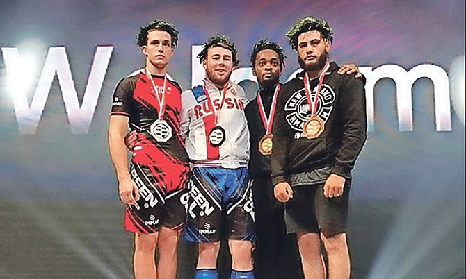 MAKING HISTORY: Christian Miller (third from left) ended up tied for the bronze medal at the
International Mixed Martial Arts Federation and the World Mixed Martial Arts Association Unified
World Championships in Manama, Bahrain.