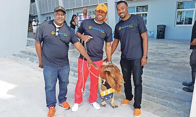 BE THE GOAT: Shown (l-r) are Rupert Gardiner, second vice president, Drumeco Archer, new president of the BAAA, and first vice president Ravanno Ferguson posing with a real goat.