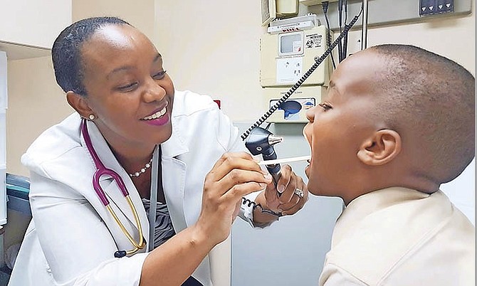 Dr Ianthe Cartwright examines a young boy in the new Doctors Hospital paediatric emergency room.