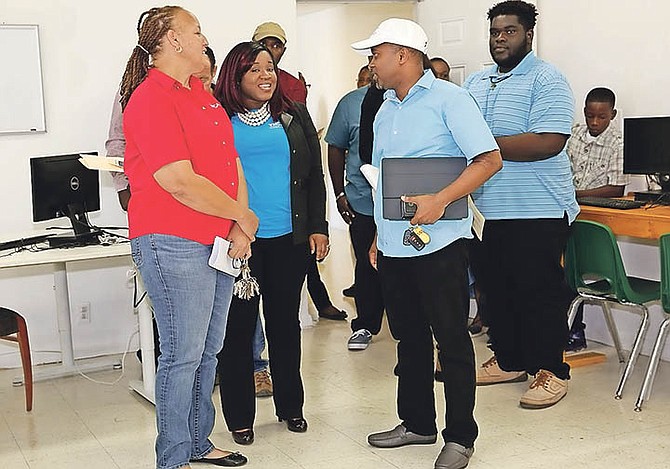 Minister of State for Grand Bahama Kwasi Thompson was given a short tour of the computer lab where the new Computer Coding, ICT Skills Development Programme will be conducted for a series of weeks at the YMCA. At left is Karon Pinder-Johnson, director of the YMCA.  Photo: Andrew Miller/BIS