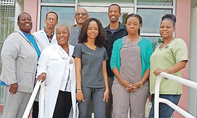 Dr Harold Munnings, second from left, rear, and a team of healthcare professionals held two free medical clinics on the weekend.