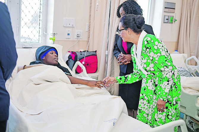 Governor General Dame Marguerite Pindling meets a patient in Princess Margaret Hospital.
Photos: Terrel W Carey Sr/Tribune staff