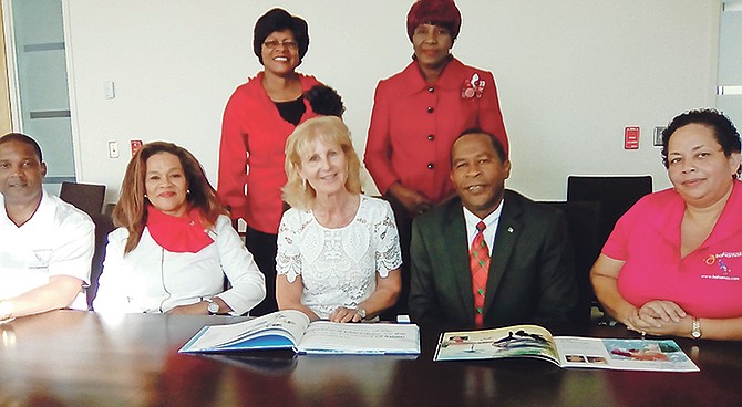 From left Jeffrey Pinder, senior executive of sustainable tourism at Ministry of Tourism; District Supt of schools in East Grand Bahama and the Cays Yvonne Ward; Helga Piaget, CEO and founder of Passion Sea; Ivan Butler, district supt of schools in West Grand Bahama; and Ministry of Tourism official Gina Turner. Standing are Ministry of Education officials. Photo: Denise Maycock