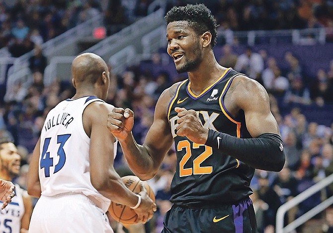 Suns centre Deandre Ayton (22) reacts after a basket and a foul against the Minnesota Timberwolves in the second half on Saturday.

(AP Photo/Ralph Freso)