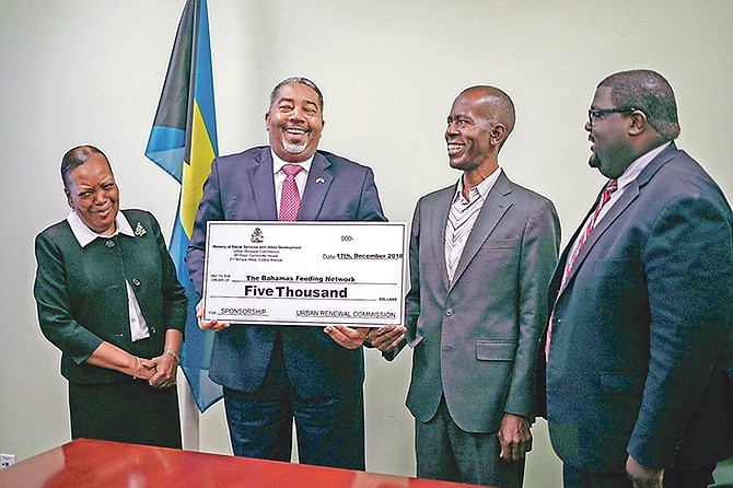 FROM left, Sherrylee Smith, permanent secretary; Minister of Social Services Frankie Campbell; Philip Smith; and Kellen Russell, acting director of Urban Renewal.