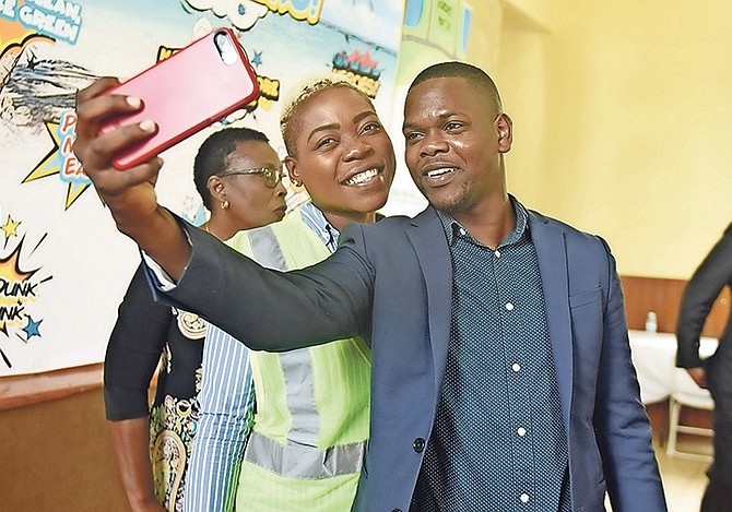 TRAVIS Robinson, Bain and Grants Town MP, poses for a selfie during a meeting yesterday at Wesley Methodist Church Hall for the environmental monitors programme, an initiative of the over-the-hill rejuvination partnership. Photo: Shawn Hanna/Tribune Staff