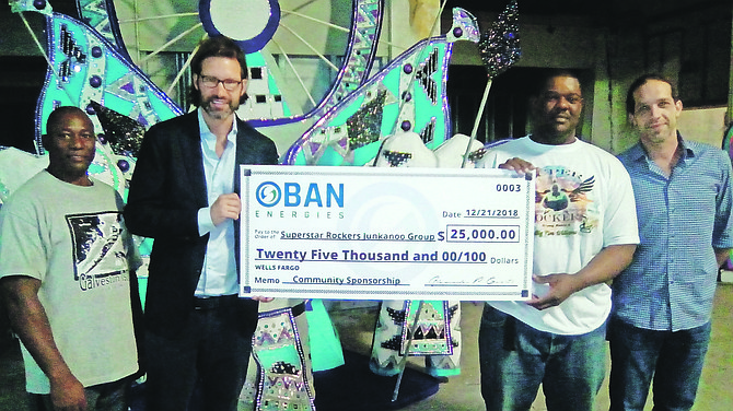 Officials from Oban Energies donated $25,000 to the Superstar Rockers in Grand Bahama. Secon left, Alexander Grikitis.